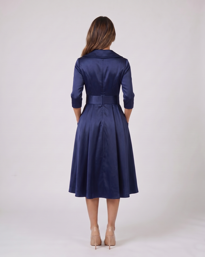 Back view of navy wrap v neck 3/4 sleeve with pockets midi dress showing solid back with center seam, concealed zipper closure