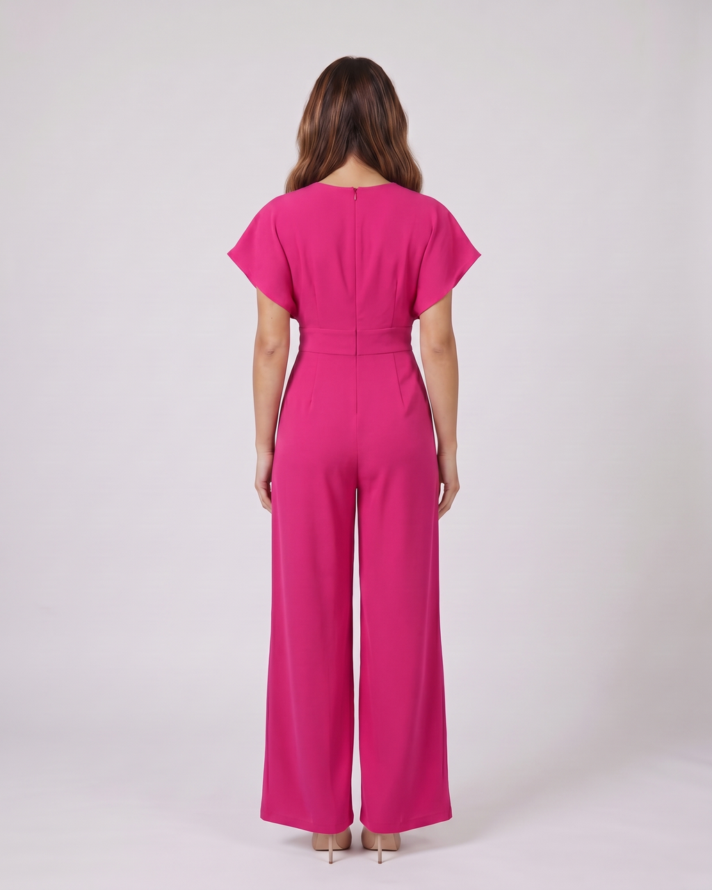 Back view of pink cocktail v neck flutter sleeve wide leg jumpsuit showing solid back with round neckline and center back zipper closure