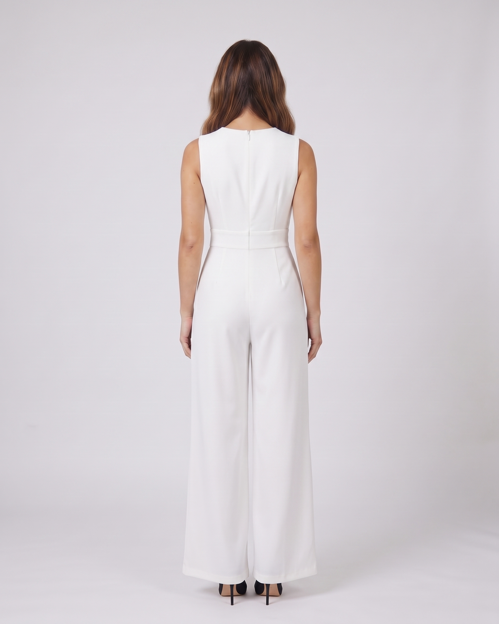 Back view of white cocktail v neck flutter sleeve wide leg jumpsuit showing solid back with round neckline and center back zipper closure