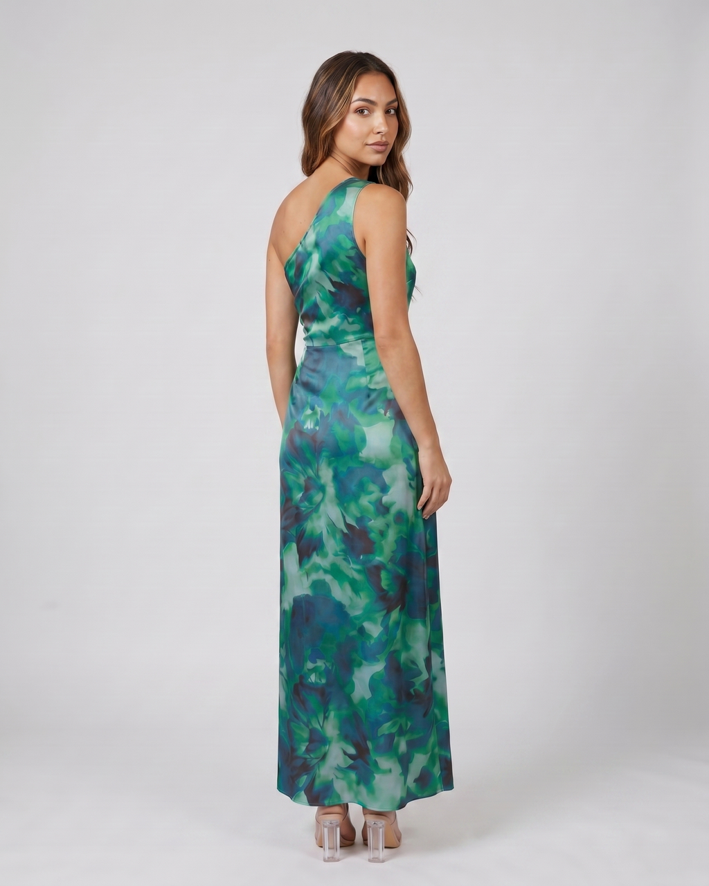 Back view of calista green floral one shoulder ruched maxi dress showing solid back
