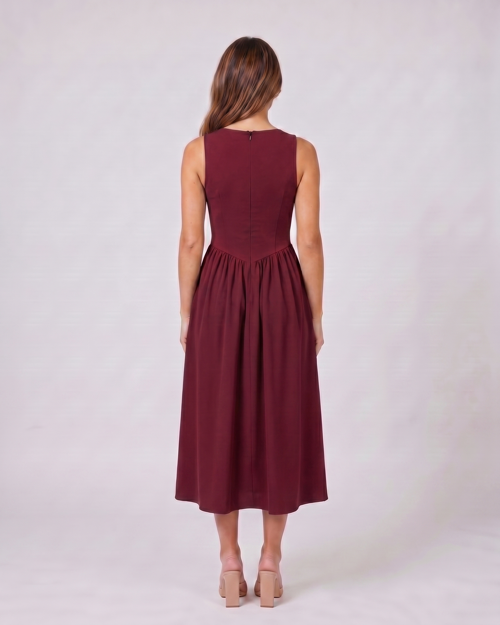 Back view of burgundy women's wedding guest deep v neck midi a line dress showing solid back with center back zipper closure