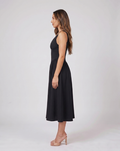 Side view of yellow flowers women's wedding guest deep v neck midi a line dress