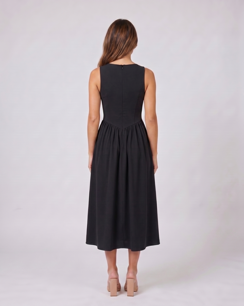 Back view of black women's wedding guest deep v neck midi a line dress showing solid back with center back zipper closure