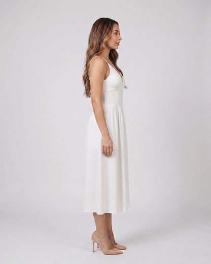 Side view of white women's wedding guest deep v neck midi a line dress