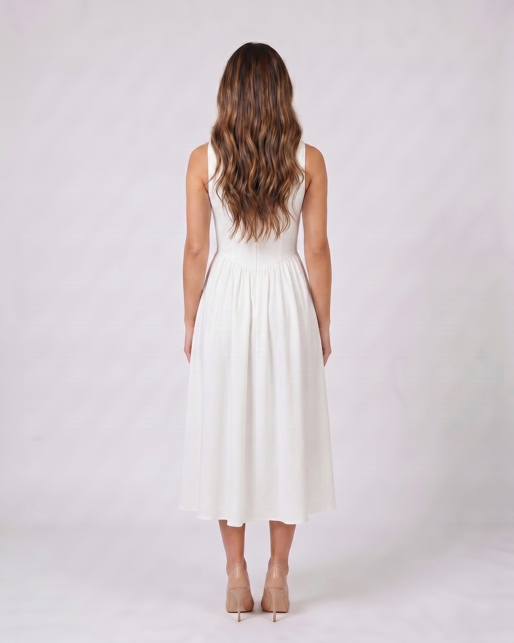 Back view of white women's wedding guest deep v neck midi a line dress showing solid back with center back zipper closure