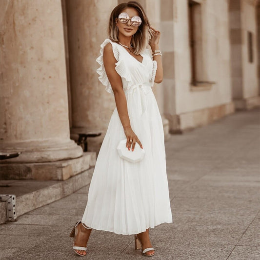 Women's white midi dress with wrap V-neckline and flutter sleeves from front angle