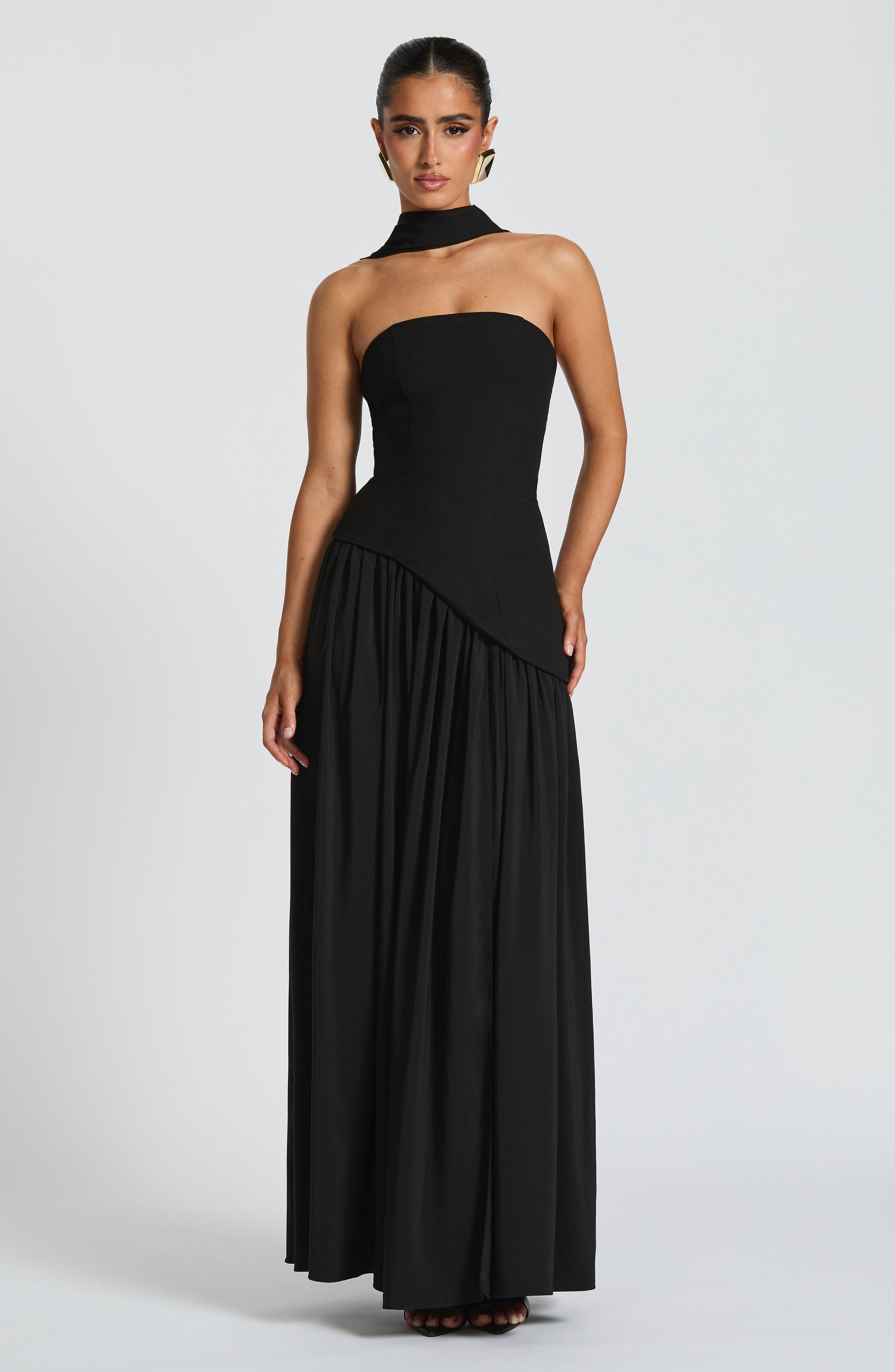 Black strapless maxi dress with choker collar and asymmetric pleated skirt