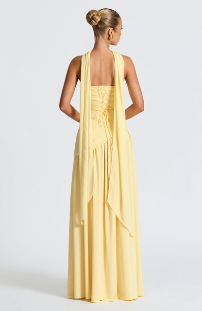 Pale yellow strapless maxi dress back view with lace-up corset detail