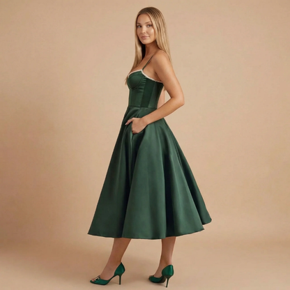Side view of dark green corset midi dress with spaghetti straps