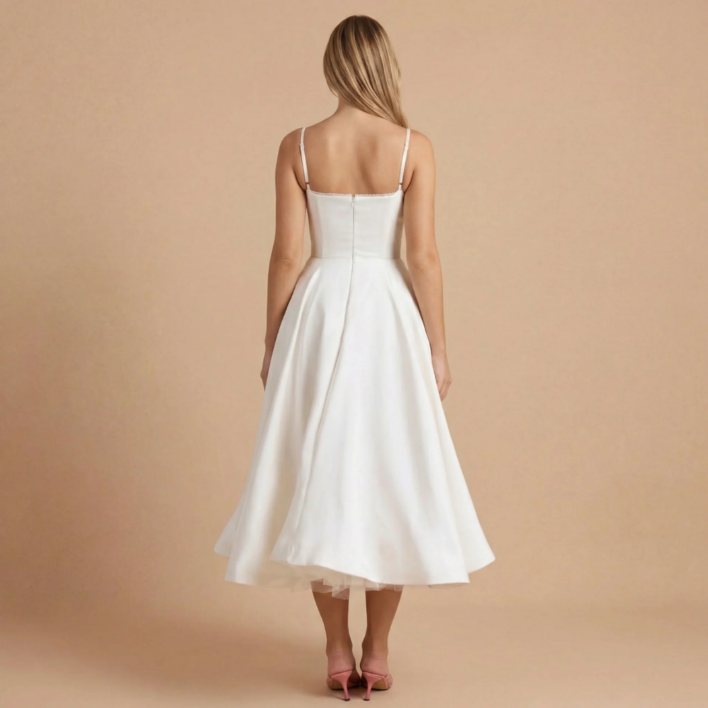 Back view of ivory corset midi dress with spaghetti straps