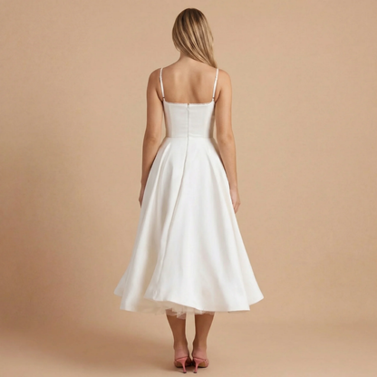 Back view of ivory corset midi dress with spaghetti straps