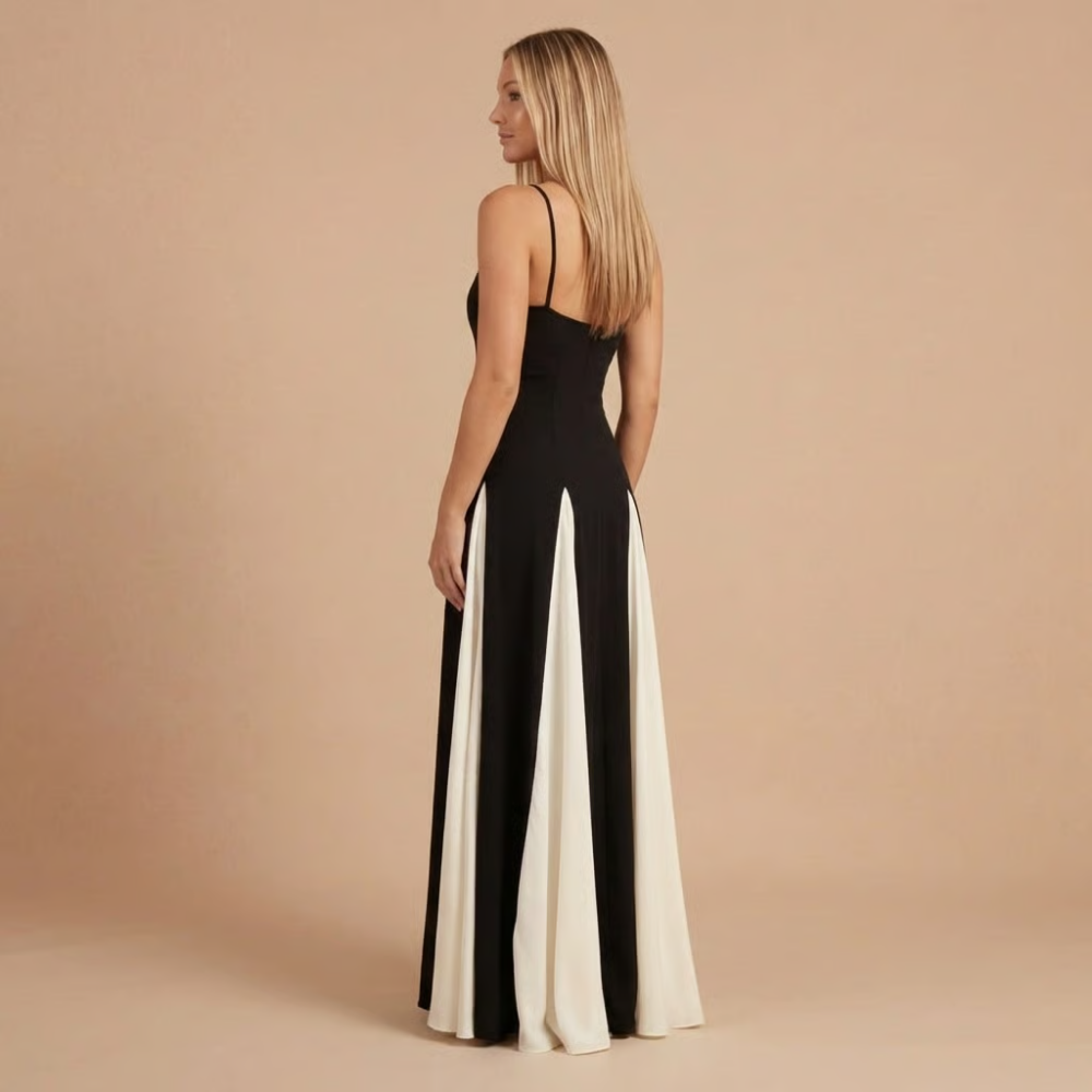 Back view of black and ivory colorblock maxi dress with flowing skirt