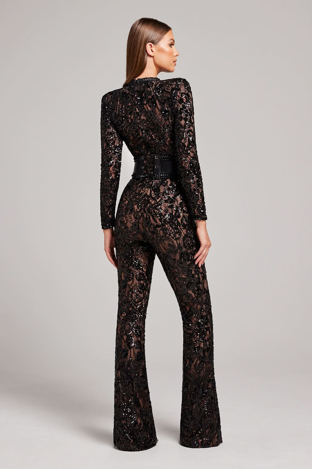 Back view of black sequin lace wide leg jumpsuit with long sleeves