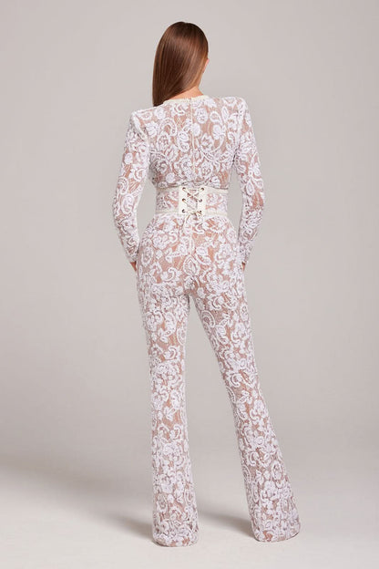 Back view of white lace jumpsuit with cream corset-style waist belt