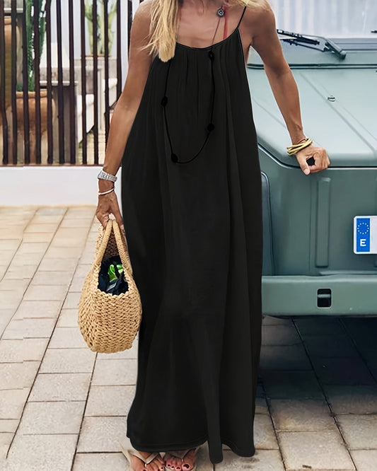 Women black backless maxi dress with V-neckline and spaghetti straps, front view on model