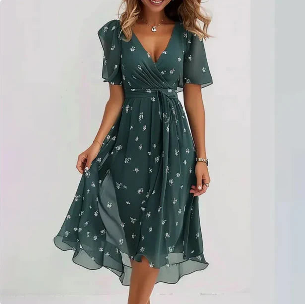 Dark teal floral print midi dress with self-tie waist and asymmetrical hemline side view