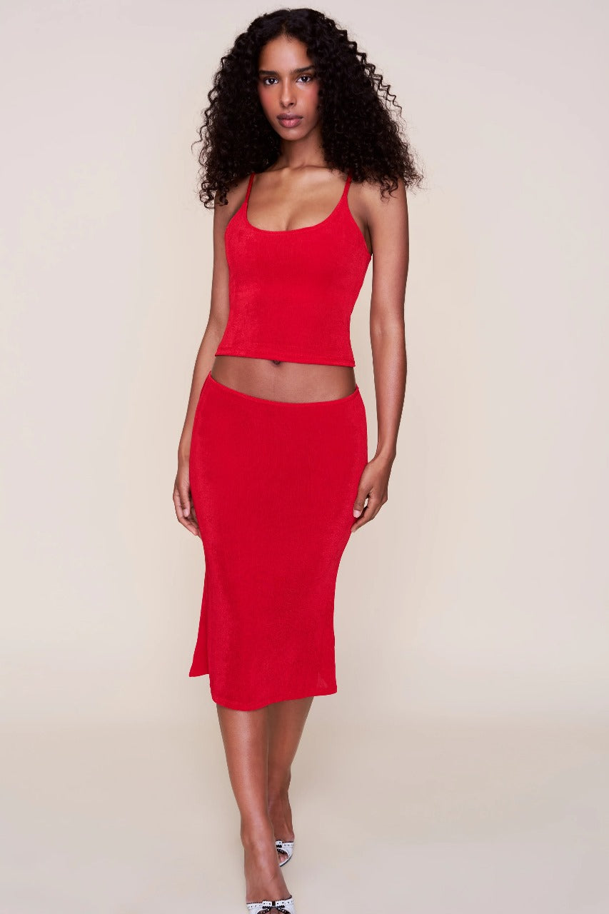 Women red two-piece set with spaghetti straps and flowing midi skirt hem