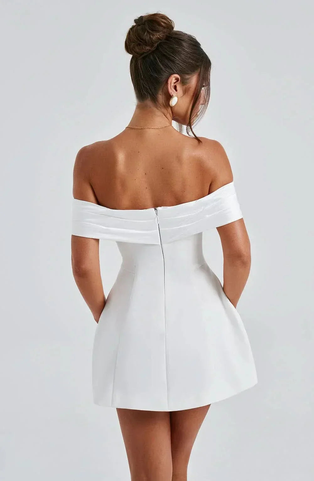 Rear view of white off-shoulder dress with center back seam