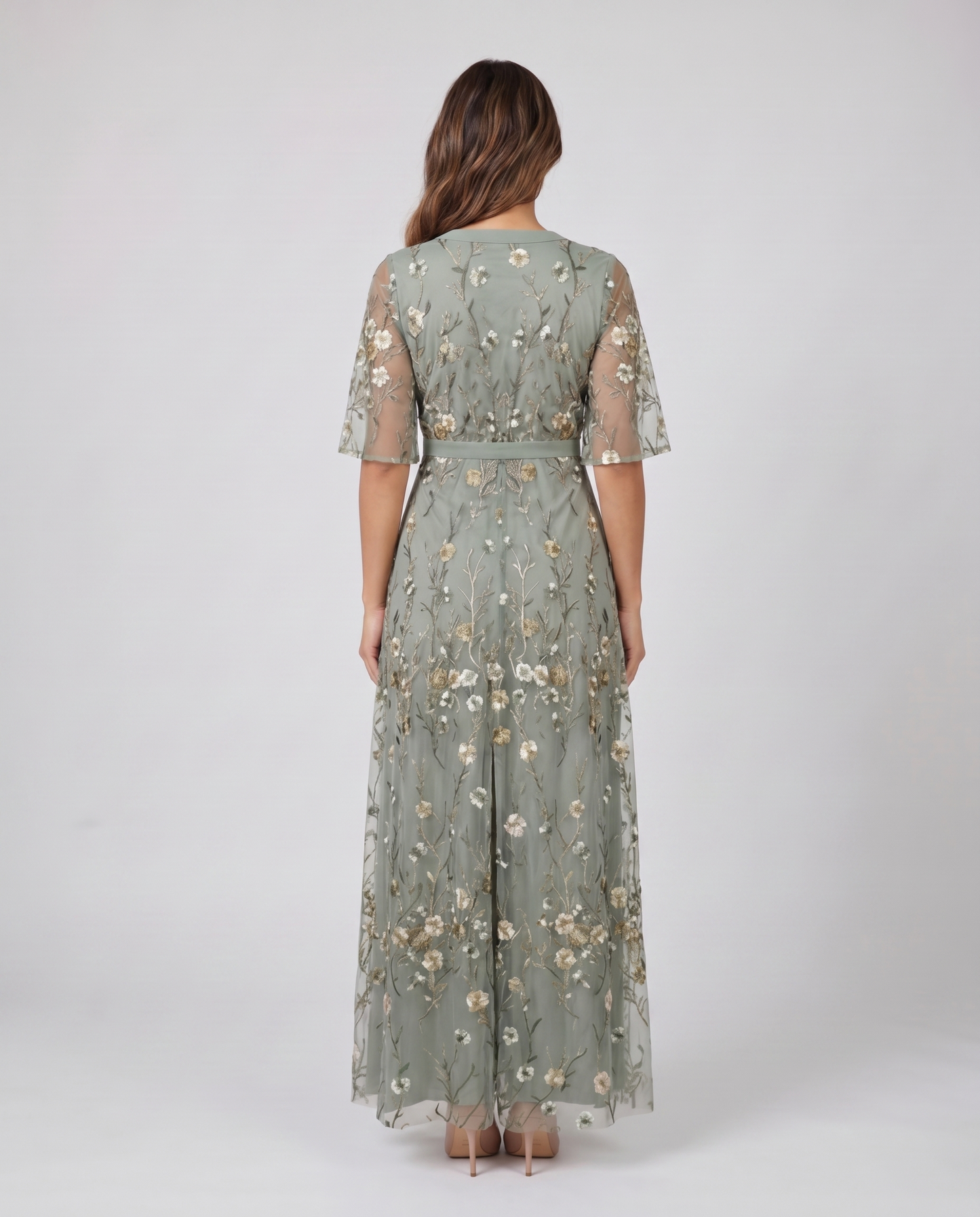 Back view of sage green embroidered wedding guest maxi dress