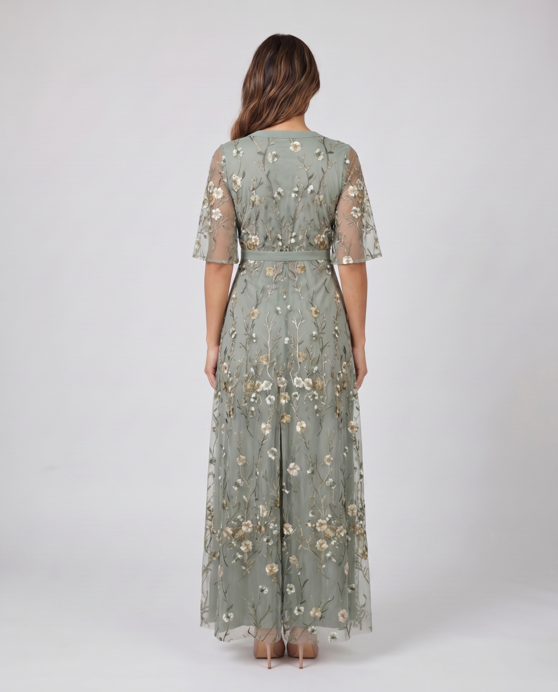 Back view of sage green embroidered wedding guest maxi dress
