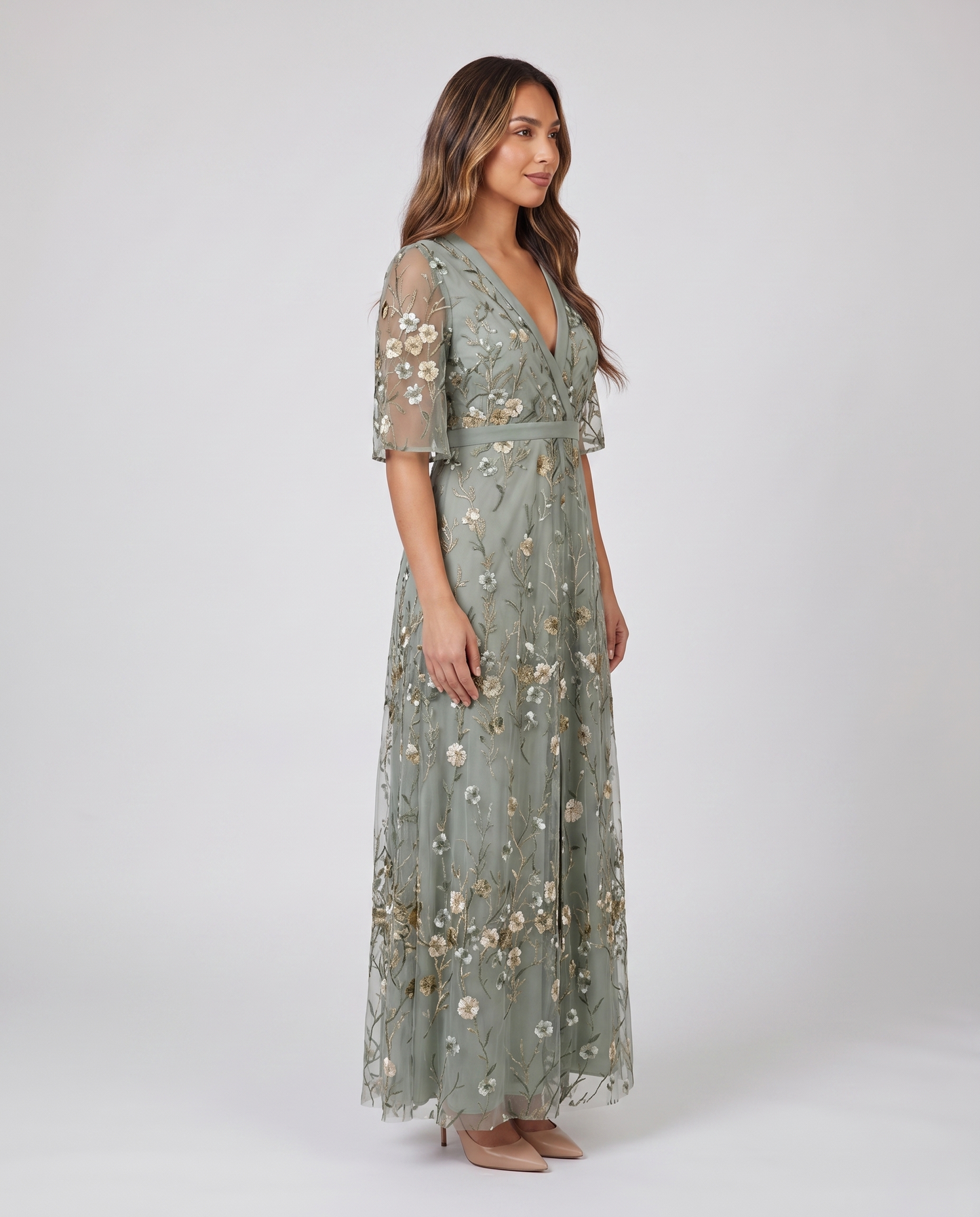 Side profile of sage green embroidered wedding guest maxi dress