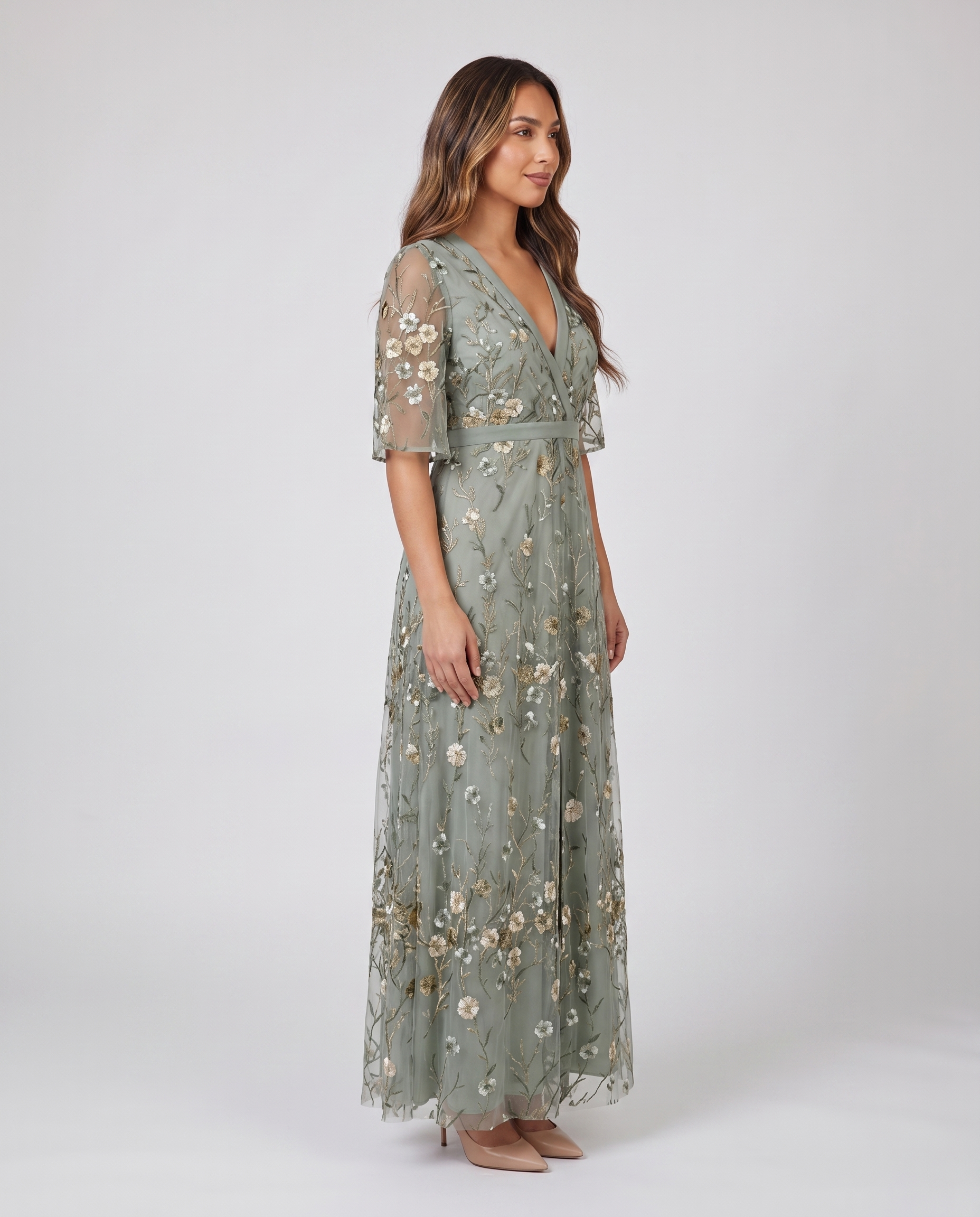 Side profile of sage green embroidered wedding guest maxi dress